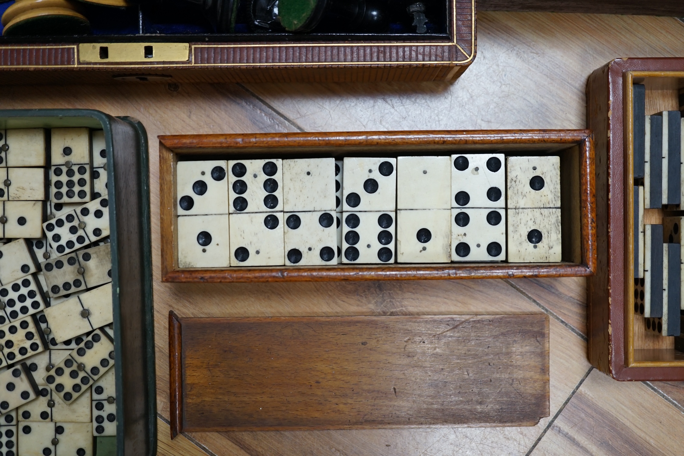 Three sets of dominoes and two chess sets, one Staunton pattern